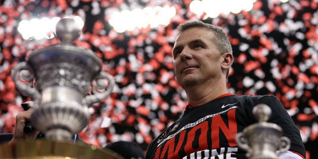 NEW ORLEANS, LA - JANUARY 01: Head coach Urban Meyer of the Ohio State Buckeyes celebrates with the trophy after defeating the Alabama Crimson Tide in the All State Sugar Bowl at the Mercedes-Benz Superdome on January 1, 2015 in New Orleans, Louisiana. The Ohio State Buckeyes defeated the Alabama Crimson Tide 42 to 35. (Photo by Chris Graythen/Getty Images)