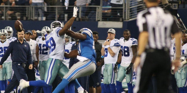 Dallas Cowboys outside linebacker Anthony Hitchens (59) gets hit in the back by a pass to Detroit Lions tight end Brandon Pettigrew (87) in the fourth quarter at AT&T Stadium Sunday, Jan. 4, 2015 in Arlington, Texas. The back judge first threw, then picked up, his penalty flag on the play. The Cowboys beat the Lions 24-20. (Paul Moseley/Fort Worth Star-Telegram/TNS via Getty Images)