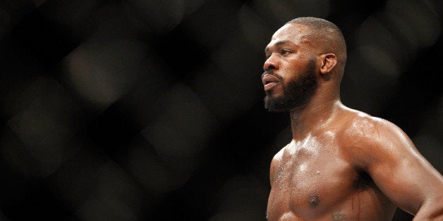 LAS VEGAS, NV - JANUARY 03: Light heavyweight champion Jon Jones waits in a time-out as he defends his title against Daniel Cormier during the UFC 182 event at the MGM Grand Garden Arena on January 3, 2015 in Las Vegas, Nevada. Jones retained his title by unanimous decision. (Photo by Steve Marcus/Getty Images)