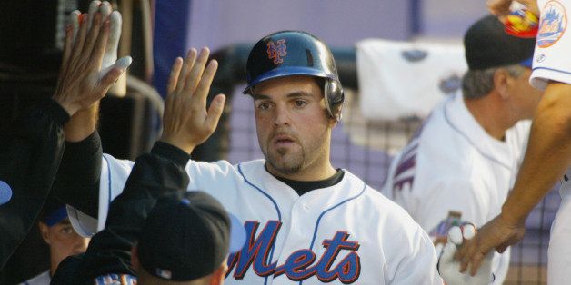 FLUSHING, NY - JULY 12: Mike Piazza #31 of the New York Mets celebrates a two run single in the seventh inning against the Philladelphia Phillies on July 12, 2002 at Shea Stadium in Flushing, New York. The Phillies edged the Mets 9-8. (Photo By Al Bello/Getty Images)