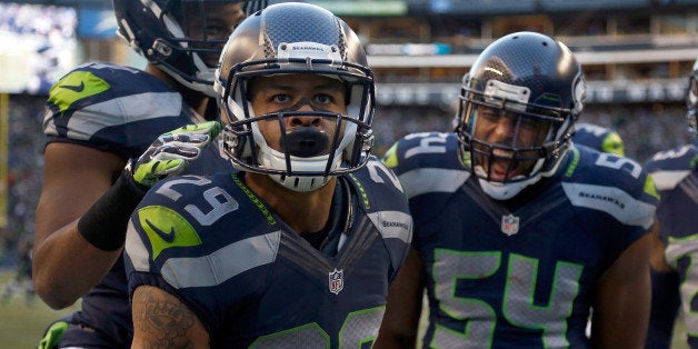 SEATTLE, WA - DECEMBER 14: Free safety Earl Thomas #29 of the Seattle Seahawks celebrates with middle linebacker Bobby Wagner #54 of the Seattle Seahawks after Thomas made a play on a kick return during the htird quarter of the game against the San Francisco 49ers at CenturyLink Field on December 14, 2014 in Seattle, Washington. (Photo by Otto Greule Jr/Getty Images)