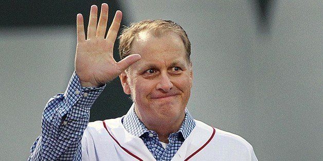 BOSTON - MAY 28: Before the game, the Red Sox honored the tenth anniversary of the 2004 World Series Championship team. Pitcher Curt Schilling, who is battling cancer acknowledges the cheers of the crowd as he walks in from left field. The Boston Red Sox hosted the Atlanta Braves in an interleague MLB game at Fenway Park. (Photo by Jim Davis/The Boston Globe via Getty Images)