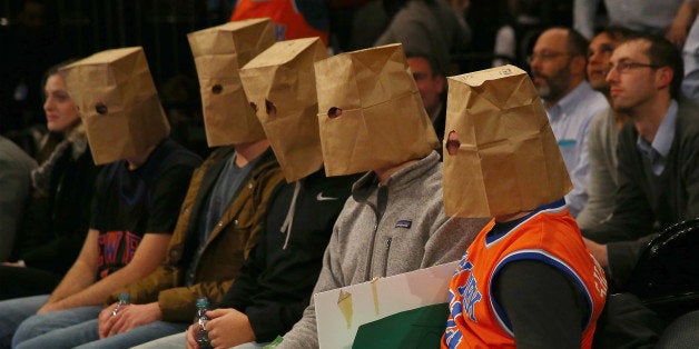 NEW YORK, NY - JANUARY 08: New York Knicks fans wear bags over their heads and react as the New York Knicks lose at Madison
