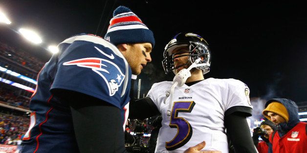 FOXBORO, MA - JANUARY 10: Joe Flacco #5 of the Baltimore Ravens and Tom Brady #12 of the New England Patriots hug following the 2015 AFC Divisional Playoffs game at Gillette Stadium on January 10, 2015 in Foxboro, Massachusetts. (Photo by Jared Wickerham/Getty Images)