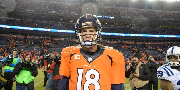 DENVER, CO - JANUARY 11: Peyton Manning (18) of the Denver Broncos walks off the field after losing to the Colts. The Denver
