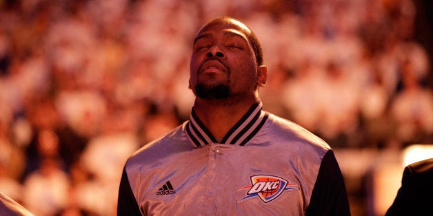 OAKLAND, CA - JANUARY 05: Kevin Durant #35 of the Oklahoma City Thunder stands for the National Anthem before their game against the Golden State Warriors at ORACLE Arena on January 5, 2015 in Oakland, California. NOTE TO USER: User expressly acknowledges and agrees that, by downloading and or using this photograph, User is consenting to the terms and conditions of the Getty Images License Agreement. (Photo by Ezra Shaw/Getty Images)