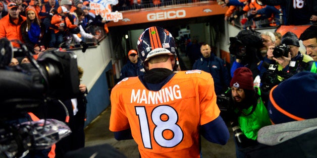 DENVER, CO - JANUARY 11: Peyton Manning (18) of the Denver Broncos walks off the field after losing to the Colts 24 to 13. The Denver Broncos played the Indianapolis Colts in an AFC divisional playoff game at Sports Authority Field at Mile High in Denver on January 11, 2015. (Photo by Tim Rasmussen/The Denver Post via Getty Images)