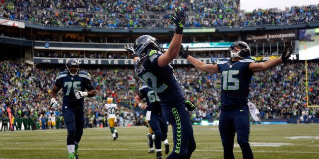 SEATTLE, WA - JANUARY 18: Jermaine Kearse #15 of the Seattle Seahawks celebrates with Luke Willson #82 of the Seattle Seahawks after catching a 35 yard game-winning touchdown in overtime against the Green Bay Packers during the 2015 NFC Championship game at CenturyLink Field on January 18, 2015 in Seattle, Washington. (Photo by Otto Greule Jr/Getty Images)