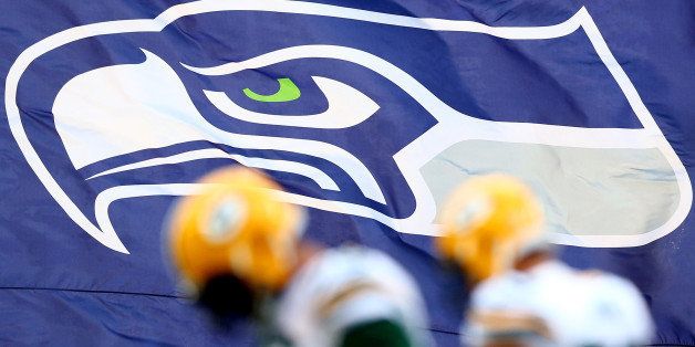 SEATTLE, WA - JANUARY 18: A Seattle Seahawks flag waves during the 2015 NFC Championship game against the Green Bay Packers at CenturyLink Field on January 18, 2015 in Seattle, Washington. (Photo by Ronald Martinez/Getty Images)