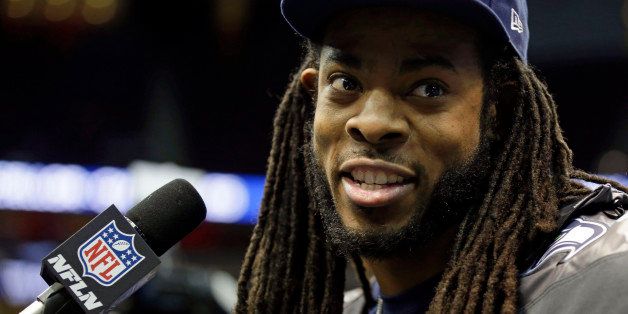 Seattle Seahawks' Richard Sherman answers a question during media day for the NFL Super Bowl XLVIII football game Tuesday, Jan. 28, 2014, in Newark, N.J. (AP Photo/Jeff Roberson)