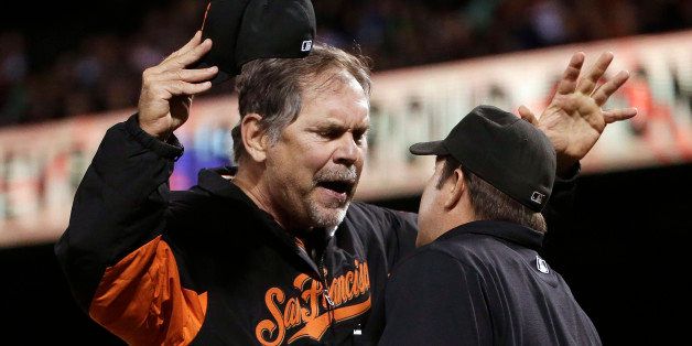 San Francisco Giants manager Bruce Bochy argues with home plate umpire Doug Eddings after Buster Posey was called out on strikes during the eighth inning of a baseball game against the Colorado Rockies on Monday, Aug. 25, 2014, in San Francisco. (AP Photo/Marcio Jose Sanchez)