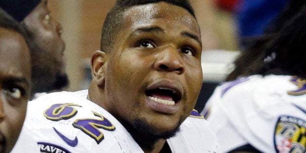 FILE - In this Dec. 16, 2013, file photo, Baltimore Ravens nose tackle Terrence Cody (62) watches the video screen from the s