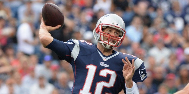 FOXBORO, MA - SEPTEMBER 21: Tom Brady #12 of the New England Patriots throws the ball in the first quarter during a game aga