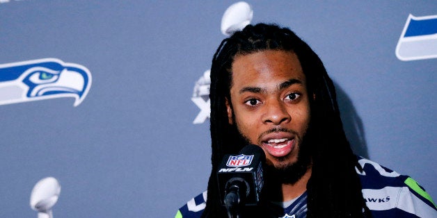 Seattle Seahawks' Richard Sherman answers a question at a news conference for NFL Super Bowl XLIX football game, Wednesday, J