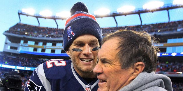 FOXBOROUGH, MA - DECEMBER 14: Patriots quarterback Tom Brady and head coach Bill Belichick share a moment as the final seconds tick off the clock in their victory, which gave them their 6th straight AFC East title. The New England Patriots hosted the Miami Dolphins in a regular season NFL game at Gillette Stadium. (Photo by Jim Davis/The Boston Globe via Getty Images)