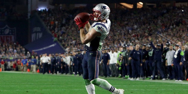 GLENDALE, AZ - FEBRUARY 1: Julian Edelman makes the game-winning catch in the fourth quarter. (Photo by Barry Chin/The Boston