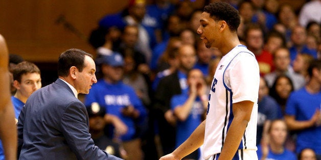 DURHAM, NC - DECEMBER 15: Head coach Mike Krzyzewski congratulates Jahlil Okafor #15 of the Duke Blue Devils as he walks to the bench against the Elon Phoenix during their game at Cameron Indoor Stadium on December 15, 2014 in Durham, North Carolina. (Photo by Streeter Lecka/Getty Images)