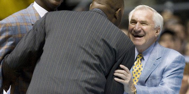 Members of North Carolina's 1982 National Championship team Michael Jordan (left), James Worthy (52) and coach Dean Smith (right) enjoy a laugh together as they watch a video tribute to their team during halftime of the North Carolina vs. Wake Forest game at the Dean Smith Center in Chapel Hill, North Carolina, Saturday, February 10, 2007. The Tar Heels defeated the Demon Deacons 104-67. (Photo by Robert Willett/Raleigh News & Observer/MCT via Getty Images)
