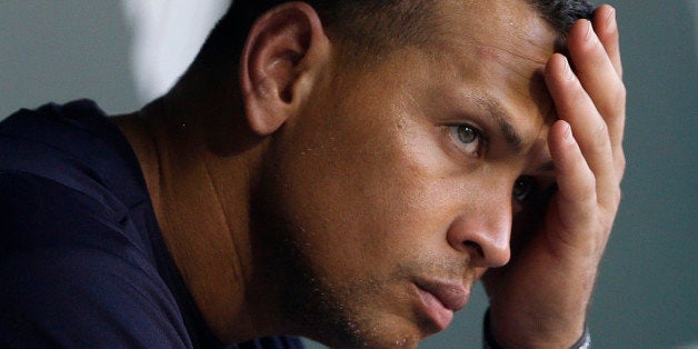 FILE - In this Sept. 11, 2013, file photo, New York Yankees' Alex Rodriguez wipes sweat from his brow as he sits in the dugout before a baseball game against the Baltimore Orioles in Baltimore. The U.S. government says New York Yankees star Alex Rodriguez paid his cousin almost $1 million to keep secret Rodriguez's use of performance enhancing drugs. In court documents filed last week in Miami, federal prosecutors say Rodriguez paid $900,000 last year to settle a threatened lawsuit by Yuri Sucart, who had worked as Rodriguez's personal assistant. Sucart, in a letter from his lawyer, threatened to expose Rodriquez's PED use if he wasn't paid $5 million. (AP Photo/Patrick Semansky, File)