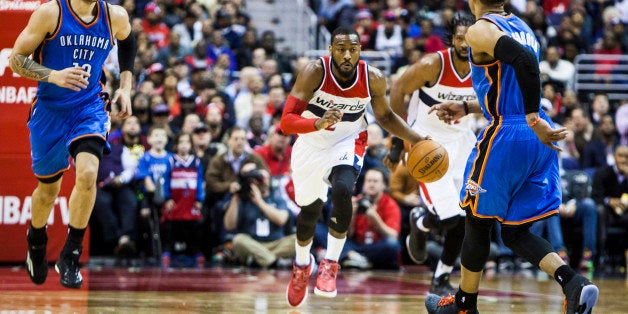 WASHINGTON, D.C. - JANUARY 21 : John Wall (2) of Washington Wizard in action against Russell Westbrook (0) and Steven Adams (12) of Oklahoma City Thunder during an NBA game at the Verizon Center in Washington, USA on January 21, 2015. (Photo by Samuel Corum/Anadolu Agency/Getty Images)