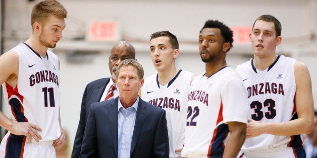 Gonzaga head coach Mark Few, second left, stands with team members, from left to right, Domantas Sabonis, Kyle Dranginis, Byron Wesley and Kyle Wiltjer during an NCAA college basketball game Saturday, Jan. 17, 2015, in Los Angeles. Gonzaga won 72-55. (AP Photo/Danny Moloshok)