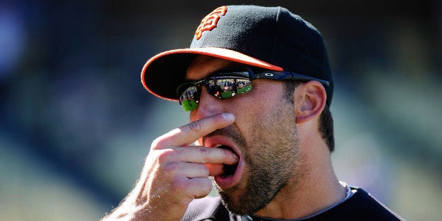 LOS ANGELES, CA - MARCH 31: Mark DeRosa #7 of the San Francisco Giants uses smokeless tobacco during warm ups prior to playing the Los Angeles Dodgers on Opening Day at Dodger Stadium on March 31, 2011 in Los Angeles, California. (Photo by Kevork Djansezian/Getty Images)