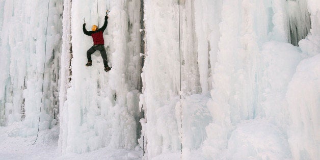 CEDAR FALLS, IA - FEBRUARY 18: Adam Kuperman climbs the side of an ice-covered grain silo February 18, 2007 in Cedar Falls, Iowa. The structures were the brainchild of Don Briggs, a physical education instructor at the University of Northern Iowa, who created the ice-climbing towers on a friend's farm to satisfy his desire to climb without leaving the flat farm fields of Northern Iowa. Briggs also uses the silos to teach the sport to his students at UNI. (Photo by Scott Olson/Getty Images)