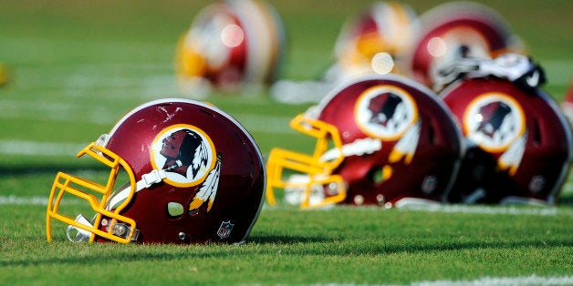 FILE - In this June 17, 2014, file photo, Washington Redskins helmets sit on the field during an NFL football minicamp in Ashburn, Va. The U.S. Patent Office ruled Wednesday, June 18, 2014, that the Washington Redskins nickname is "disparaging of Native Americans" and that the team's federal trademarks for the name must be canceled. The ruling comes after a campaign to change the name has gained momentum over the past year. (AP Photo/Nick Wass, File)