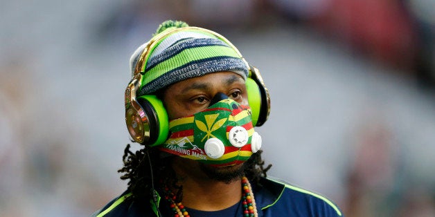 GLENDALE, AZ - FEBRUARY 01: Marshawn Lynch #24 of the Seattle Seahawks warms up prior to Super Bowl XLIX against the New Eng