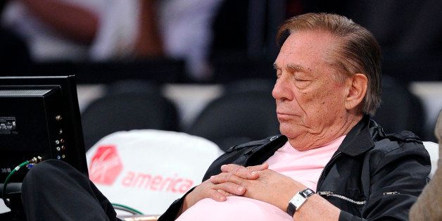 Los Angeles Clippers team owner Donald Sterling closes his eyes for several seconds as he watches his team play the Utah Jazz during the second half of their preseason NBA basketball game, Saturday, Oct. 16, 2010, in Los Angeles. (AP Photo/Mark J. Terrill)