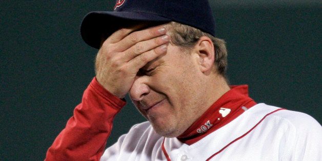 ** FILE ** In this Oct. 13, 2007 file photo, Boston Red Sox pitcher Curt Schilling reacts after giving up a solo home run to Cleveland Indians' Grady Sizemore in the fifth inning of Game 2 of the American League Championship baseball series at Fenway Park in Boston. Schilling says he's out for the season, and his career may be over. The 41-year-old Boston Red Sox right-hander said Friday June 20, 2008 on radio station WEEI he will have shoulder surgery next week. (AP Photo/Elise Amendola, File)