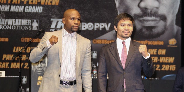 LOS ANGELES, CA - MARCH 11: Profesional Boxers Floyd Mayweather and Manny Pacquiao attend the press conference to announce upcoming fight with Floyd Mayweather and Manny Pacquiao at The Nokia Theatre L.A. Live on March 11, 2015 in Los Angeles, California. (Photo by Paul Archuleta/FilmMagic)