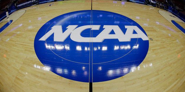 The NCAA logo is shown before Albany's practice for a second-round game of the NCAA college basketball tournament, Thursday, March 21, 2013, in Philadelphia. (AP Photo/Matt Slocum)