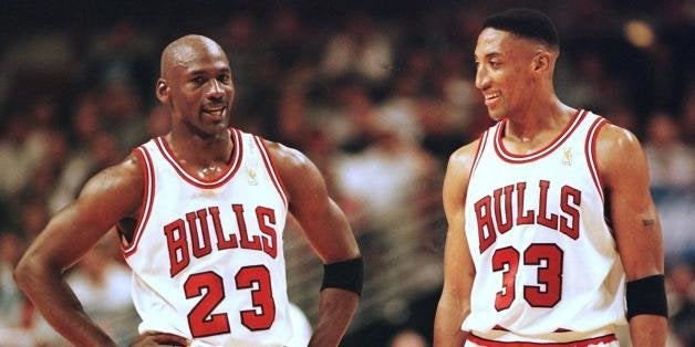 CHICAGO, UNITED STATES: Michael Jordan (L) and Scottie Pippen (R) of the Chicago Bulls talk during the final minutes of their game 22 May in the NBA Eastern Conference finals aainst the Miami Heat at the United Center in Chicago, Illinois. The Bulls won the game 75-68 to lead the series 2-0. AFP PHOTO/VINCENT LAFORET (Photo credit should read VINCENT LAFORET/AFP/Getty Images)