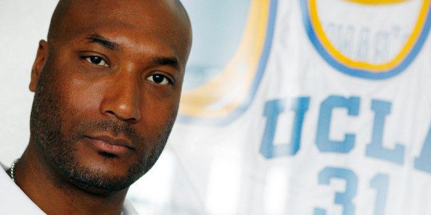 FILE - In this Sept. 18, 2010, file photo, former UCLA basketball player Ed O'Bannon Jr. sits in his office in Henderson, Nev. EA shares undisclosed royalties with the NCAA for use of college stadiums, team names and uniforms and the playersâ images in a game that racks up hundreds of millions of dollars in annual sales. Because they are amateur athletes, the players do not receive any direct benefit from the appearances of their nameless images in the game. Former University of Nebraska quarterback Sam Keller and an increasing number of players such as former UCLA basketball star OâBannon think they should and have filed at least nine federal lawsuits against the NCAA and EA over the last two years. (AP Photo/Isaac Brekken, File)