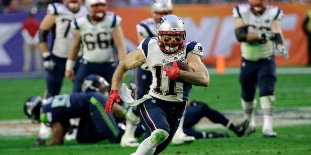 New England Patriots wide receiver Julian Edelman (11) runs after catching a pass during the first half of NFL Super Bowl XLIX football game against the Seattle Seahawks Sunday, Feb. 1, 2015, in Glendale, Ariz. (AP Photo/David J. Phillip)