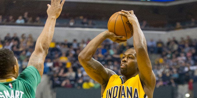 Indiana Pacers guard Rodney Stuckey (2) shoots against Boston Celtics guard Marcus Smart (36) during the first half of an NBA basketball game, Saturday, March 14, 2015, in Indianapolis. (AP Photo/Doug McSchooler)