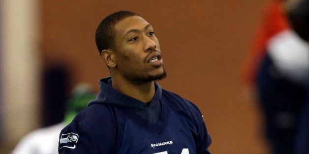 Seattle Seahawks defensive end Bruce Irvin stretches at the start of NFL football practice Friday, Jan. 31, 2014, in East Rutherford, N.J. The Seahawks and the Denver Broncos are scheduled to play in the Super Bowl XLVIII football game Sunday, Feb. 2, 2014. (AP Photo/Jeff Roberson)