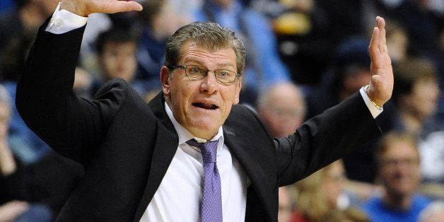 FILE - In this Jan. 18, 2015, file photo, UConn women's basketball head coach Geno Auriemma reacts during the second half of an NCAA college basketball game against South Florida in Storrs, Conn. Auriemma can record his 900th career win on Tuesday when his second-ranked Huskies host Cincinnati. (AP Photo/Jessica Hill, File)
