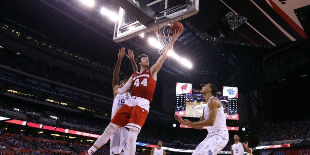 INDIANAPOLIS, IN - APRIL 04: Frank Kaminsky #44 of the Wisconsin Badgers drives to the basket against Willie Cauley-Stein #15