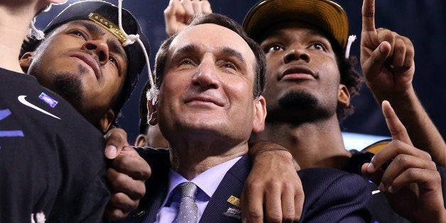 INDIANAPOLIS, IN - APRIL 06: Head coach Mike Krzyzewski of the Duke Blue Devils watches 'One Shining Moment' with Quinn Cook