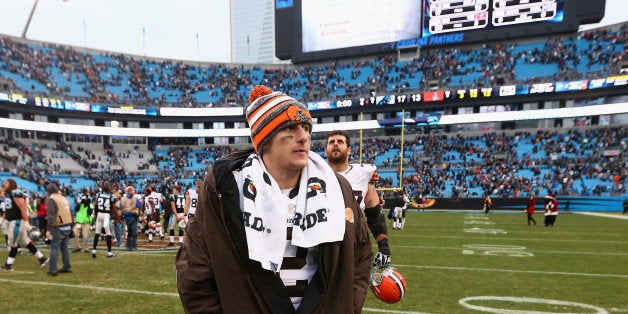 CHARLOTTE, NC - DECEMBER 21: The injured Johnny Manziel #2 of the Cleveland Browns leaves the field after a 17-13 loss to the Carolina Panthers at Bank of America Stadium on December 21, 2014 in Charlotte, North Carolina. (Photo by Streeter Lecka/Getty Images)