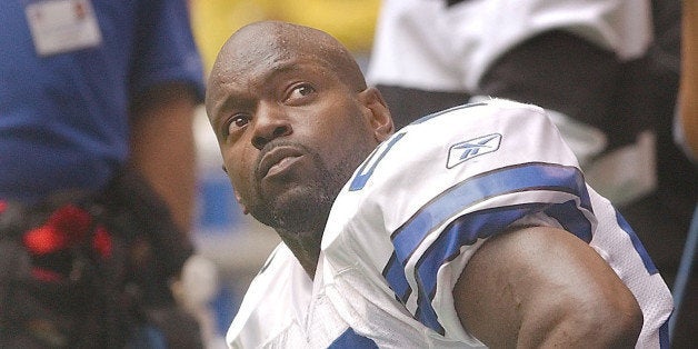 Former Dallas Cowboys running back, Emmitt Smith, looks towards to the score board after a short celebration on the field hon