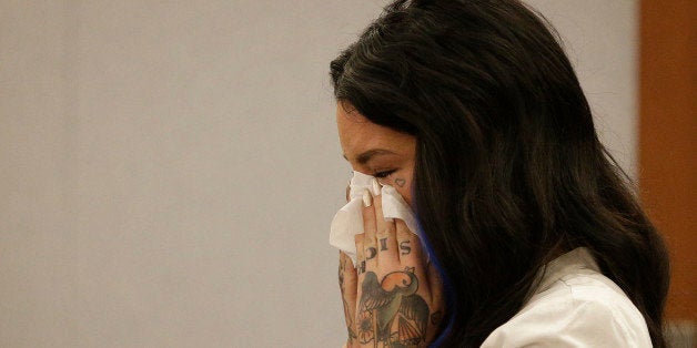 Christine Mackinday, also known as Christy Mack, cries on the witness stand during a preliminary hearing for Jonathan Paul Ko