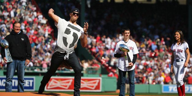 BOSTON, MA - APRIL 13: New England Patriots quarterback Tom Brady throws the first pitch before the game between the Washington Nationals and the Boston Red Sox at Fenway Park on April 13, 2015 in Boston, Massachusetts. (Photo by Maddie Meyer/Getty Images)