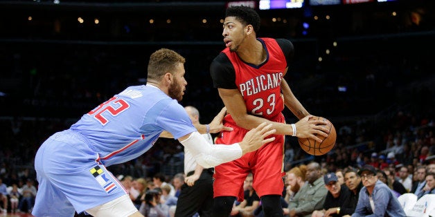 New Orleans Pelicans' Anthony Davis, right, is defended by Los Angeles Clippers' Blake Griffin during the first half of an NBA basketball game, Sunday, March 22, 2015, in Los Angeles. (AP Photo/Jae C. Hong)