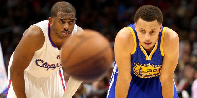 LOS ANGELES, CA - MARCH 31: Stephen Curry #30 of the Golden State Warriors and Chris Paul #3 of the Los Angeles Clippers on
