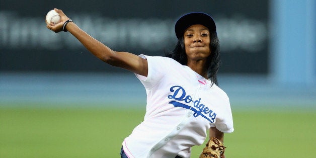 LOS ANGELES, CA - SEPTEMBER 02: Little League Baseball pitcher Mo'ne Davis throws out the ceremonial first pitch prior to the start of the game between the Los Angeles Dodgers and the Washington Nationals at Dodger Stadium on September 2, 2014 in Los Angeles, California. (Photo by Jeff Gross/Getty Images)