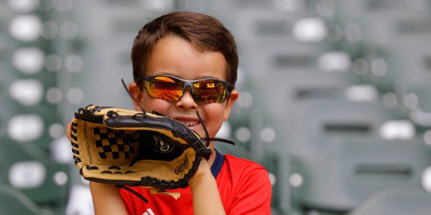 MILWAUKEE, WI - MAY 26: A boy watches batting practice before the Baltimore Orioles and Milwaukee Brewers baseball game at Miller Park on May 26, 2014 in Milwaukee, Wisconsin. (Photo by Jeffrey Phelps/Getty Images)