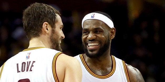 CLEVELAND, OH - DECEMBER 23: LeBron James #23 and Kevin Love #0 of the Cleveland Cavaliers react after a play in the second half against the Minnesota Timberwolves at Quicken Loans Arena on December 23, 2014 in Cleveland, Ohio. NOTE TO USER: User expressly acknowledges and agrees that, by downloading and or using this photograph, User is consenting to the terms and conditions of the Getty Images License Agreement. (Photo by Mike Lawrie/Getty Images)